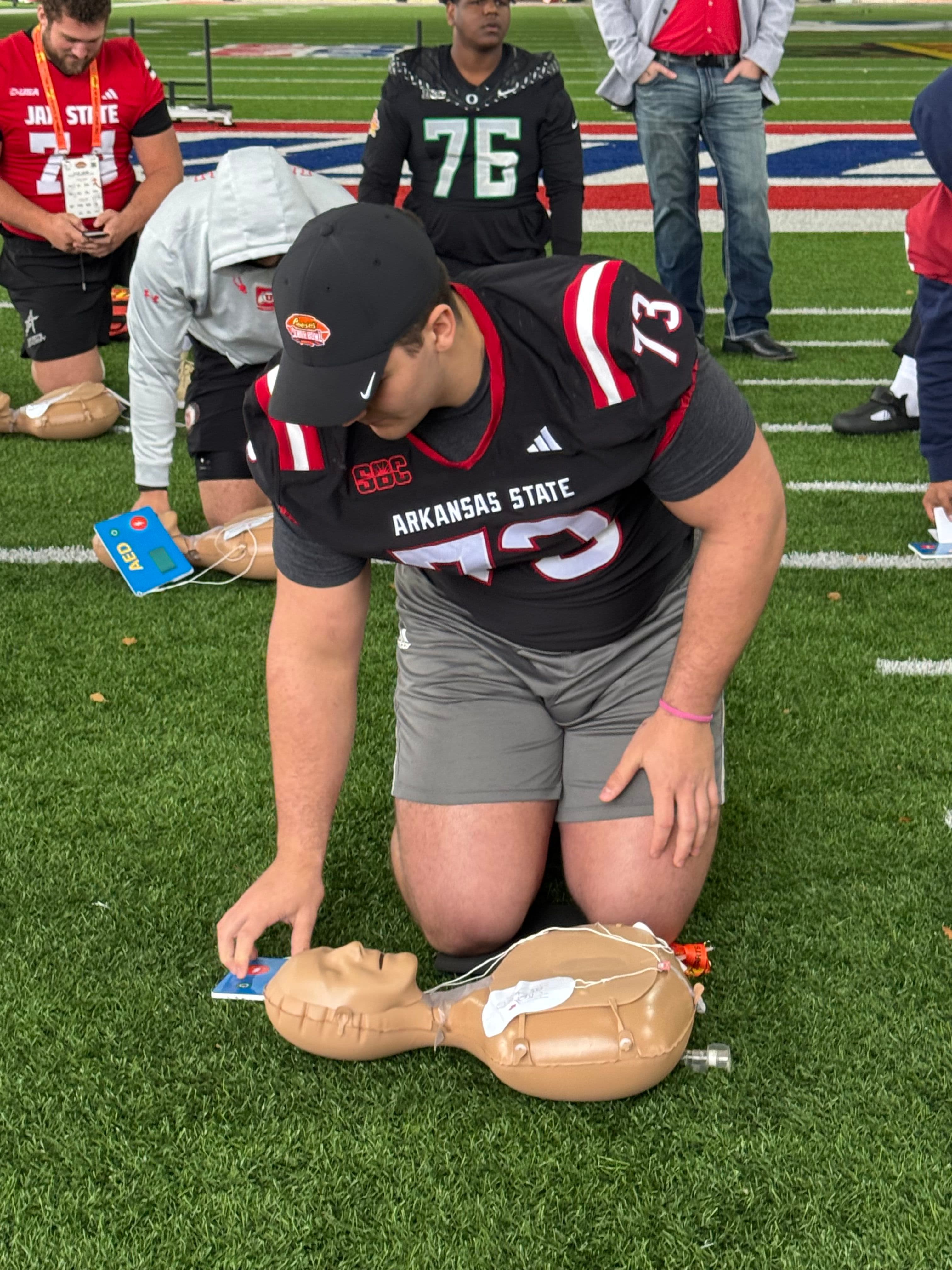 NFL Draft Prospects and Coaches Learn Life-Saving CPR Skills at Reese's Senior Bowl
